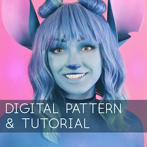 May include: A woman wearing a blue wig with two buns, blue face paint, and large pink ears. The text "DIGITAL PATTERN & TUTORIAL" is at the bottom of the image.
