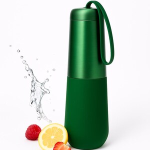 May include: A green insulated water bottle with a handle, next to a splash of water, a raspberry, a lemon slice, and a strawberry slice. The bottle has a brushed metal top and a smooth, rounded base.