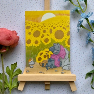 Choucas corbeau mignon dans un champ de tournesols - carte postale en A6