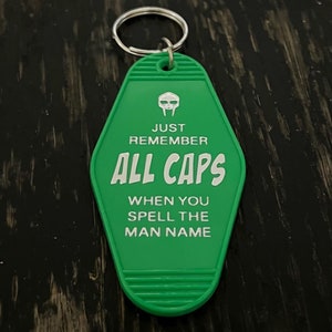 Supervillain ALL CAPS chrome-embossed Motel Key Tag.