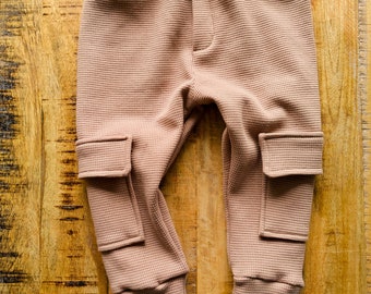 Unisex cargo joggers made from waffle cotton. Chunky, cosy and comfy trousers for autumn/winter season. Baby & toddler. Made in the UK