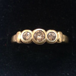 Diamanten, cognacbruine 3 diamanten 9k gouden ring