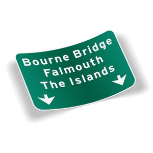May include: A green road sign sticker with white text reading "Bourne Bridge Falmouth The Islands" and downward arrows. The sticker has a white border and a subtle shadow.