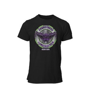 May include: Black t-shirt with a green and silver circular graphic featuring a purple robot with the text "Devastator Construction Since 1984".