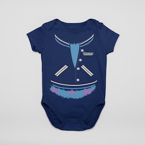 May include: A navy blue baby onesie with a graphic of a blue and white varsity jacket with the text "Monsters University" on the right side. The bottom of the graphic is a blue and purple fuzzy monster with white polka dots.
