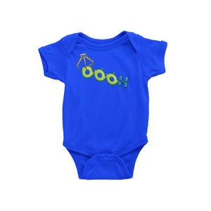 May include: A blue baby onesie with a green alien character and the text "Boo!" printed on the front.
