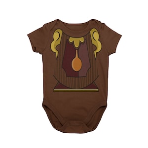 May include: A brown baby onesie with a cartoon image of a wooden clock face with a gold pendulum and gold trim.