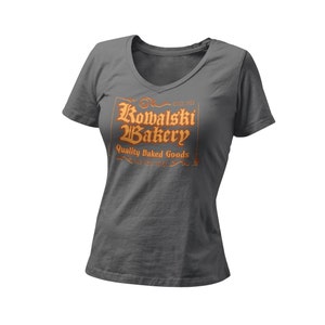 Kowalski Bakery Women’s Fitted V Neck Shirt | Quality Baked Goods New York City | Wizard World Shirt | Fantastic Magic Creatures Beast |Park