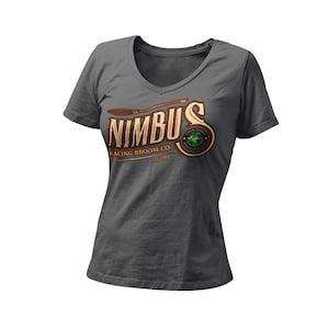 May include: A dark gray V-neck t-shirt with a brown and gold logo that says "Nimbus Racing Broom Co. Est. 1967". The logo features a stylized broom and a globe with wings.