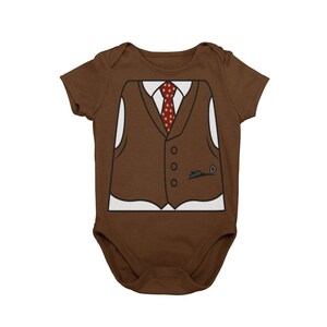 May include: Brown baby onesie with a white graphic of a brown vest, white shirt, and red tie with white polka dots.