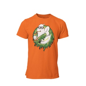 May include: Orange t-shirt featuring a cartoon ghost wearing sunglasses and holding a drink. The ghost is surrounded by green slime. The design is centered on the front of the shirt.