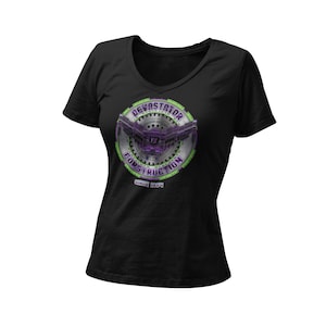 May include: Black V-neck t-shirt featuring a circular graphic with the text "Devastator Construction" and the year "Since 1984". The graphic has a purple and green color scheme, with a detailed mechanical design.