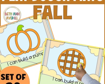 May include: A set of 20 fall-themed play dough mats. The mats feature outlines of a pumpkin and a pie, with the text "I can build a pumpkin" and "I can build a pie".