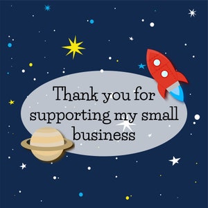 May include: A thank you card with a space theme. The card features a red rocket, a yellow star, a beige planet, and white stars on a dark blue background. The text on the card reads "Thank you for supporting my small business."
