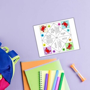 May include: A printable origami fortune teller with a red crab design. The fortune teller has eight flaps with different prompts written on them. The prompts include "Show me your best Excited face!" and "Pretend I held you a super funny story. Show me how you feel!"