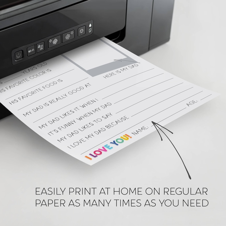 May include: A white sheet of paper emerging from a black printer featuring a fill-in-the-blank questionnaire titled I LOVE YOU! with prompts like HIS FAVORITE COLOR IS, MY DAD IS REALLY GOOD AT, and MY DAD LIKES IT WHEN I, including a space for a photo.
