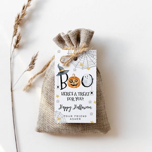 May include: A white gift tag with a pumpkin, ghost, and spider web design. The tag says "BOO! Here's a treat for you! Happy Halloween Your friend Asher".