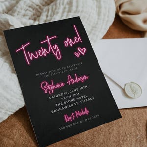 May include: Black invitation card with pink neon text that reads "Twenty one!" and "Stephanie Anderson". The invitation is for a 21st birthday party on Saturday, June 10th at 7pm at The Stone Hotel in Brunswick St, Fitzroy. RSVP to Michelle by May 20th.