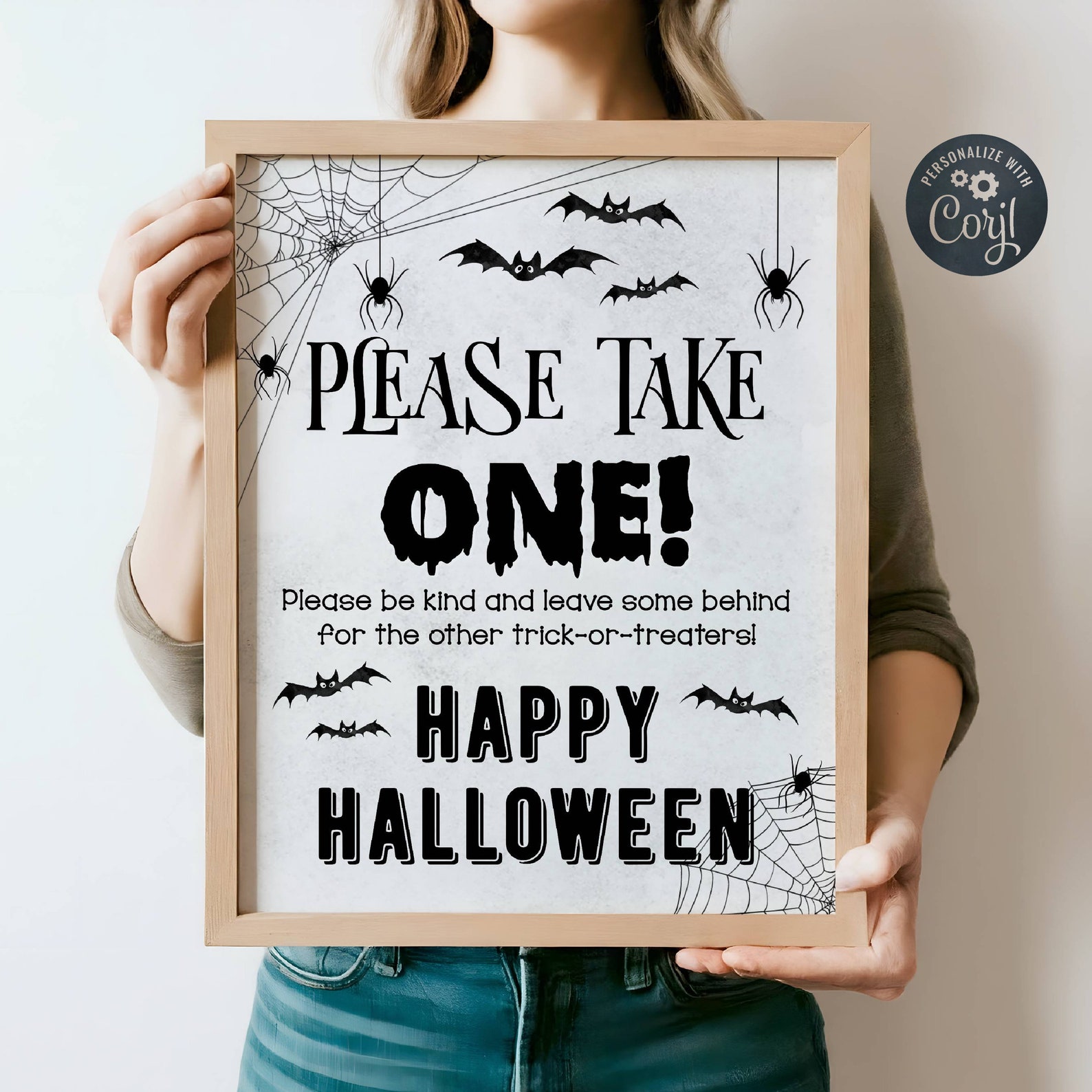 A Spiderweb Frame with a Short Request Black-and-white Halloween sign reading please take one with spiders and bats.