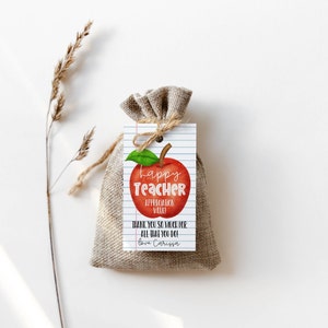 May include: A red apple with a green stem and leaf, with the words "Happy Teacher Appreciation Week!" and "Thank you so much for all that you do! Love Carissa" on a white and blue lined tag.
