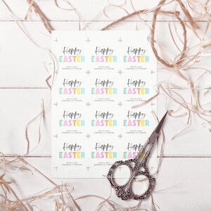 May include: A sheet of printable gift tags with a colorful Happy Easter design. The tags feature a rainbow color scheme with the words "Happy Easter" in a bold, playful font. The text "With Love, Annabelle Simons" is included on each tag.