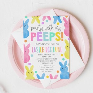 May include: An Easter-themed invitation with colorful bunny illustrations and the text "party with my PEEPS!" on a white background. The invitation is on a pink plate with an envelope.