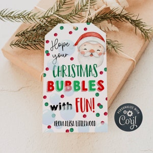 May include: A white gift tag with a cartoon Santa Claus, red and green polka dots, and the text "Hope your Christmas Bubbles with Fun! From Alisa Littlewood".