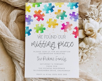 May include: A rectangular white invitation card featuring a colorful watercolor puzzle piece pattern at the top with gold speckles. The text reads: WE FOUND OUR missing piece, PLEASE JOIN US FOR AN ADOPTION CELEBRATION HONORING the Pickens Family, SATURDAY 12 FEBRUARY FROM 2PM, THE PICKENS RESIDENCE, 76 EVERGREEN DRIVE, SNOHOMISH, RSVP to Alisa (555) 000 000.