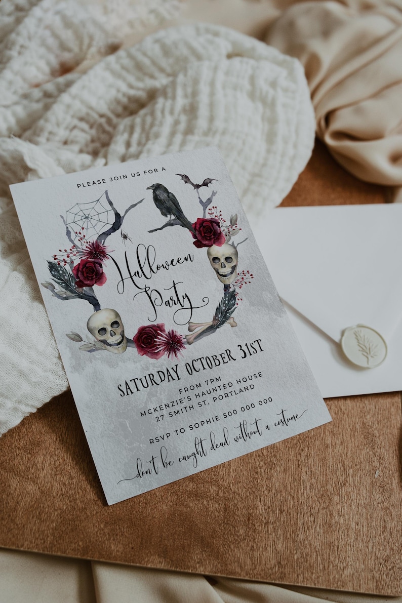 May include: A Halloween party invitation with a watercolor illustration of skulls, roses, and a raven. The text reads "Please join us for a Halloween Party, Saturday October 31st, from 7pm, McKenzie's Haunted House, 27 Smith St, Portland, RSVP to Sophie 500 000 000, don't be caught dead without a costume."