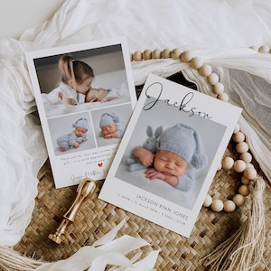May include: Two baby announcement cards with photos of a newborn baby and a sibling. One card features the name "Jackson" in script. The cards are on a woven surface with decorative beads and a gold wax seal.