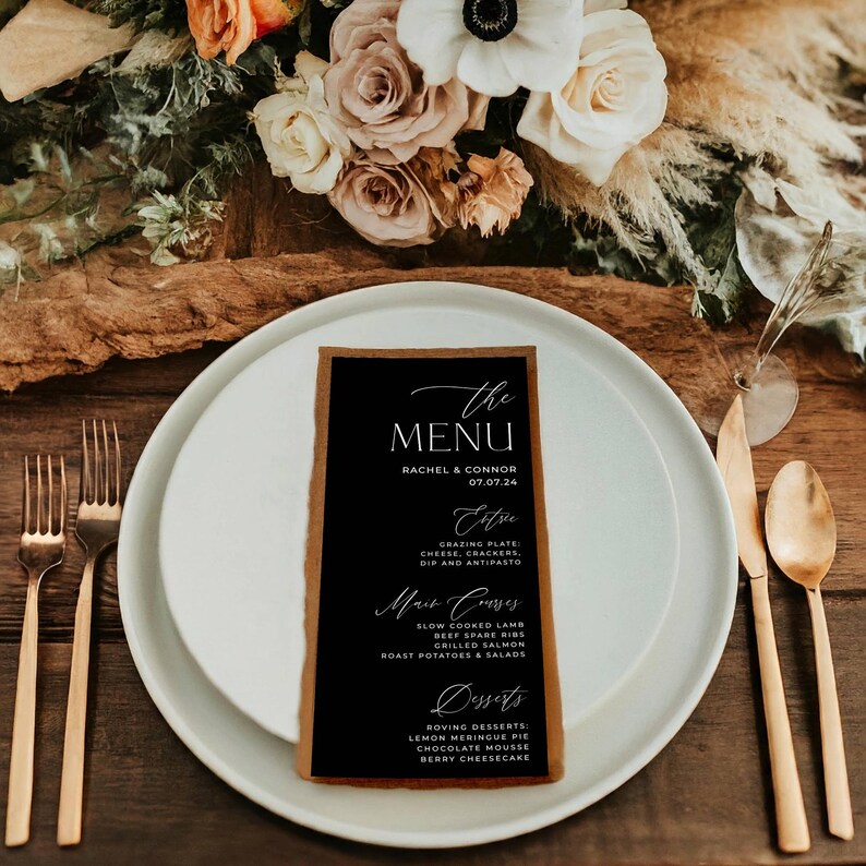 May include: A black and brown wedding menu card with white text. The menu includes appetizers, main courses, and desserts. The text reads "The Menu" with the names Rachel & Connor and the date 07.07.24.
