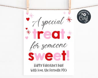 May include: A white Valentine's Day sign with the text "A special treat for someone sweet!" in black, red, and pink. The sign is decorated with hearts and stars and is held by wooden clothespins.