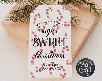 May include: White gift tag with a red and white candy cane pattern. The text reads "Wishing you a super sweet Christmas. Love the Rowan Family."  A black circle with white text reads "Personalize with Caryl".