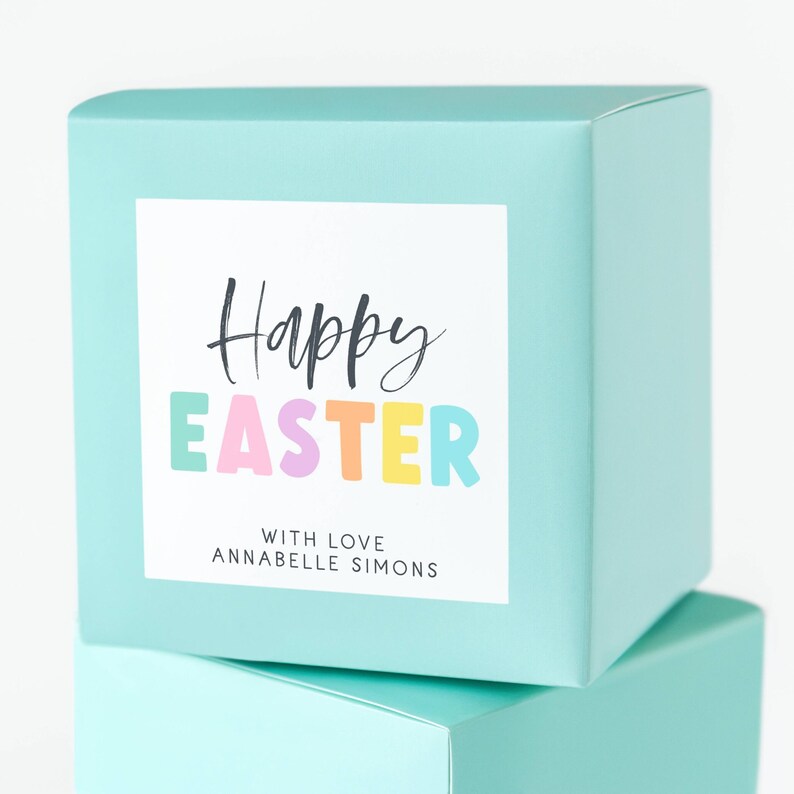 May include: A turquoise gift box with a white label that says "Happy Easter" in black script with the word "Easter" in colorful letters. The label also says "With love, Annabelle Simons".