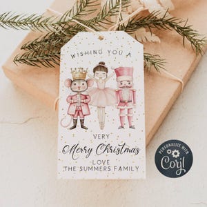 May include: A white gift tag with gold glitter dots features a watercolor illustration of a ballerina, a nutcracker, and a mouse king. The text reads "Wishing you a very Merry Christmas Love The Summers Family" and includes a personalized logo with the text "Personalize with Caryl".