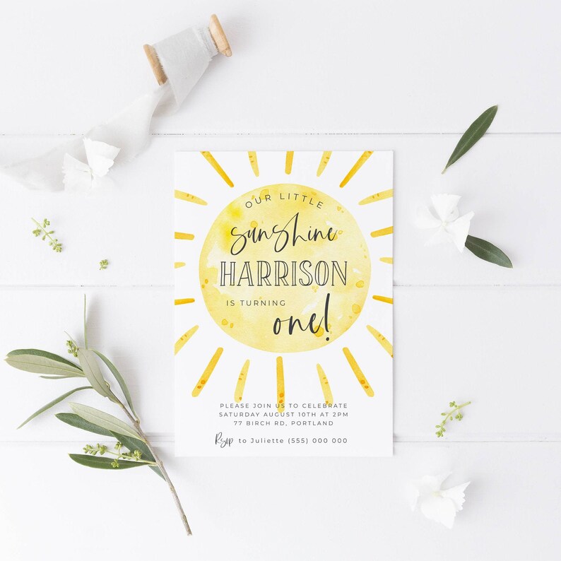 May include: A yellow watercolor sun with the text "Our Little Sunshine Harrison is turning one!"  Please join us to celebrate Saturday August 10th at 2pm 77 Birch Rd, Portland RSVP to Juliette (555) 000 000.
