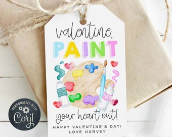 Puede incluir: Una etiqueta de regalo blanca para el Día de San Valentín con una ilustración de acuarela de una paleta de pintura, pinceles y tubos de pintura. El texto dice "valentine, PAINT your heart out! Happy Valentine's Day! Love Harvey."