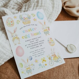 May include: An Easter egg hunt invitation with pastel illustrations of bunnies, eggs, and flowers. The invitation includes the event details: date, time, location, and RSVP information. A white envelope with a wax seal is also present.