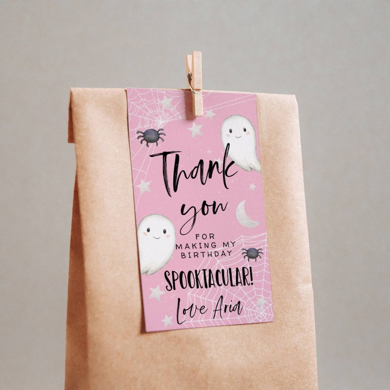 May include: Pink thank you tag with a ghost and spider illustration. The text reads "Thank you for making my birthday spooktacular! Love Aria."