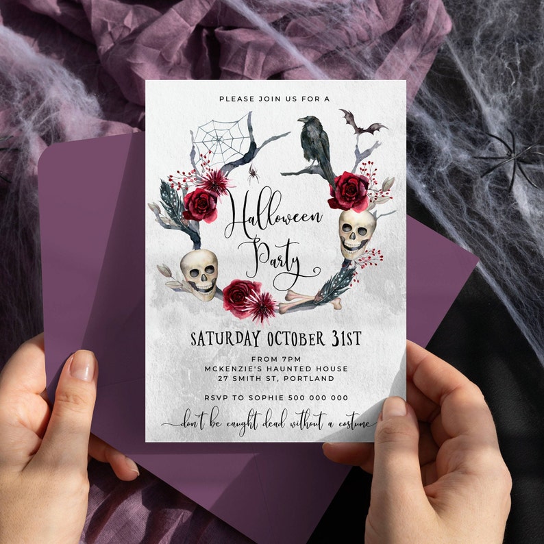 May include: Halloween party invitation with a spooky skull and floral wreath design. The invitation reads "Halloween Party" and "Saturday October 31st" with details about the party location and RSVP information. The text at the bottom reads "don't be caught dead without a costume."