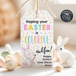 May include: A white gift tag with colorful polka dots and the text "Hoping your EASTER is COLORFUL and fun! Happy Easter! Love Alexa Jones". A cartoon bunny rabbit holding paintbrushes is in the lower left corner.