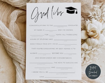 May include: A white rectangular card featuring the black text Grad libs and a graduation cap icon. The card contains fill-in-the-blank lines for a graduation game, including prompts like Congratulations to the graduate, My name is, and The keys to success are.