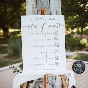 May include: A white wedding order of events sign featuring black text and icons. The sign lists Audrey & Josiah, the schedule from 4:00 PM to 11:00 PM, and the date 10.10.26 in Richmond, VA. It includes icons for rings, cocktails, dinner, music, cake, and sparklers.