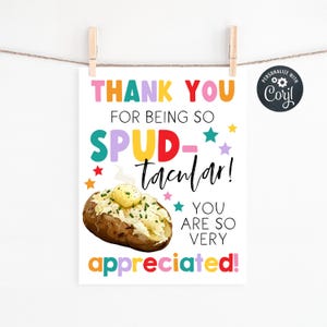 May include: A white poster with the text "THANK YOU FOR BEING SO SPUD-tacular! YOU ARE SO VERY APPRECIATED!" is held by wooden clips. A baked potato with butter and chives is illustrated below the text. Colorful stars and text accents the design.