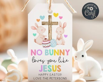 Puede incluir: Etiqueta de regalo de Pascua con dos conejos sosteniendo huevos de Pascua y una cruz. La etiqueta dice "Ningún conejito te quiere como Jesús" y "¡Feliz Pascua! Con cariño, los Petersons".