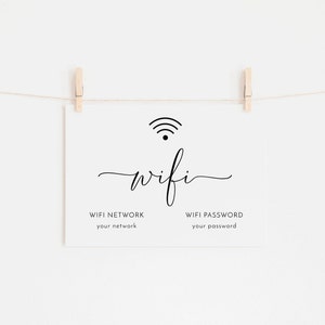 May include: A white sign with the word "wifi" in a cursive font, along with a wifi symbol. The sign is held by two wooden clothespins on a string. Below the word "wifi" are the words "WIFI NETWORK your network" and "WIFI PASSWORD your password".
