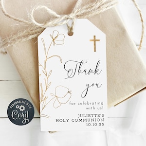 Puede incluir: Etiqueta de agradecimiento blanca con diseño floral dorado y una cruz dorada. El texto dice "Gracias por celebrar con nosotros! La comunión de Juliette 10.10.25"