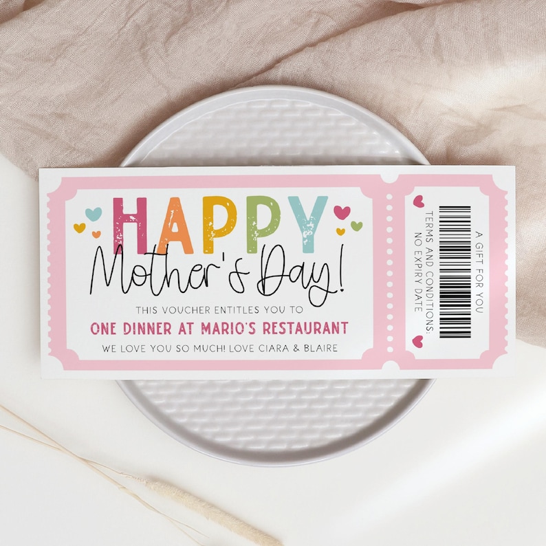 May include: Pink and white gift certificate with the text "HAPPY Mother's Day!" and "This voucher entitles you to one dinner at Mario's Restaurant. We love you so much! Love Ciara & Blair".