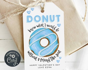 Può includere: Un'etichetta regalo bianca con un'illustrazione di ciambella blu e il testo "DONUT know what I would do without a friend like you!" Buon San Valentino Amore Ezra.