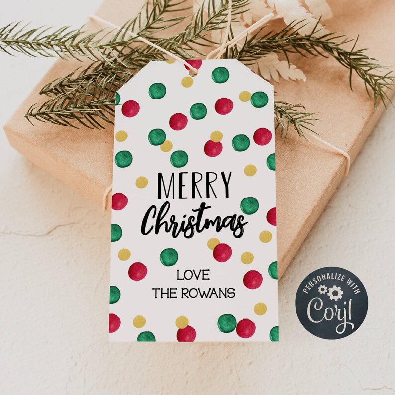 May include: White gift tag with a red, green, and gold polka dot pattern. The tag says "Merry Christmas" and "Love The Rowans".